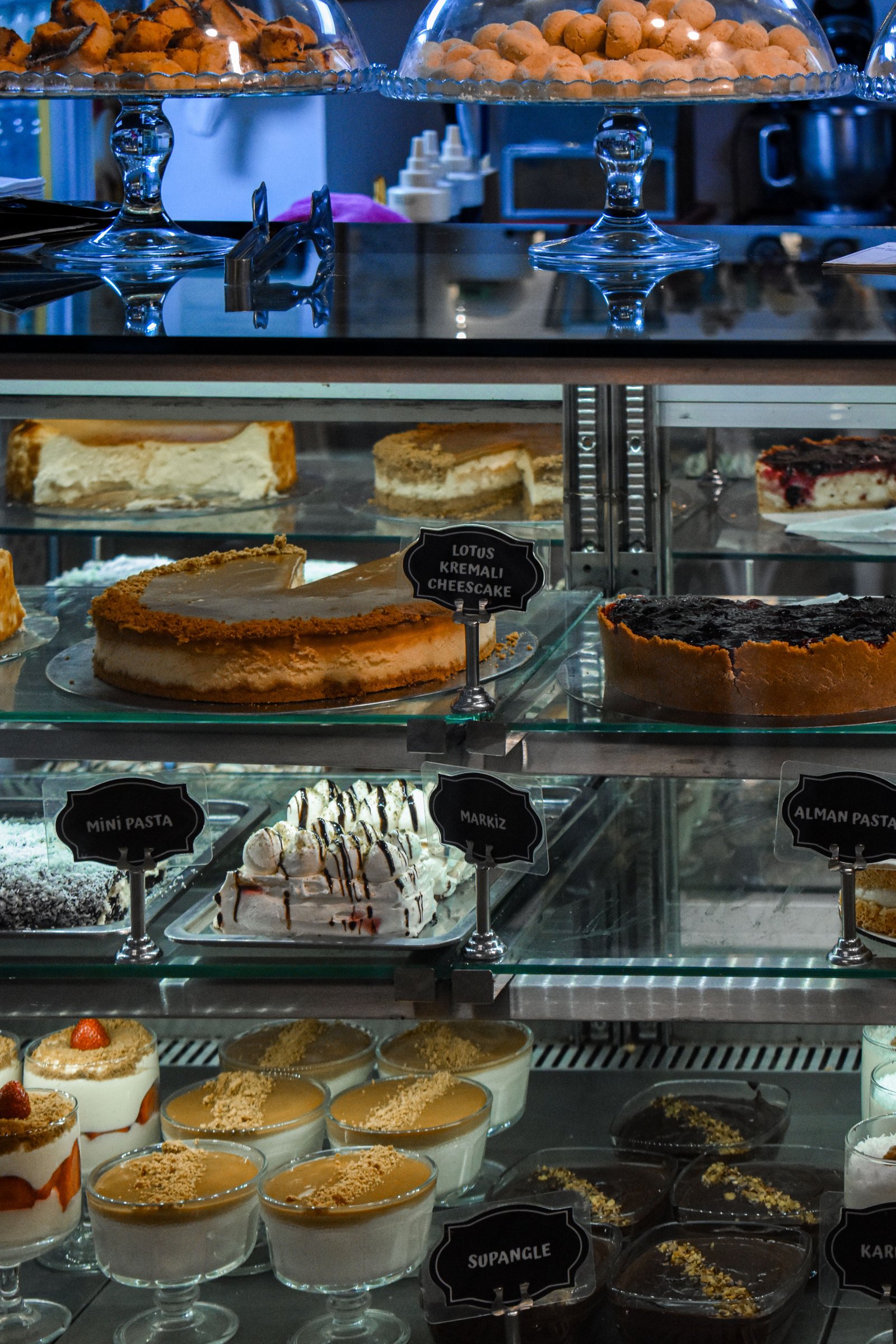 Bakery display case filled with cheesecakes, pastries and desserts at Crumb and Kiln